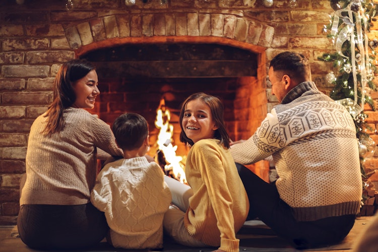 Family in front of fire