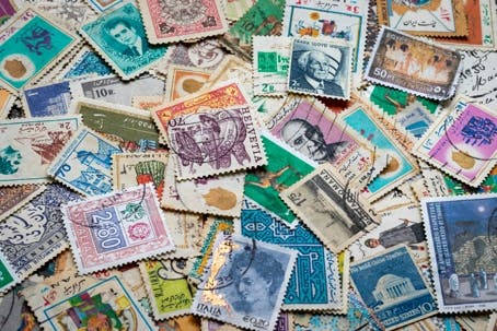 stamps scattered on a desk