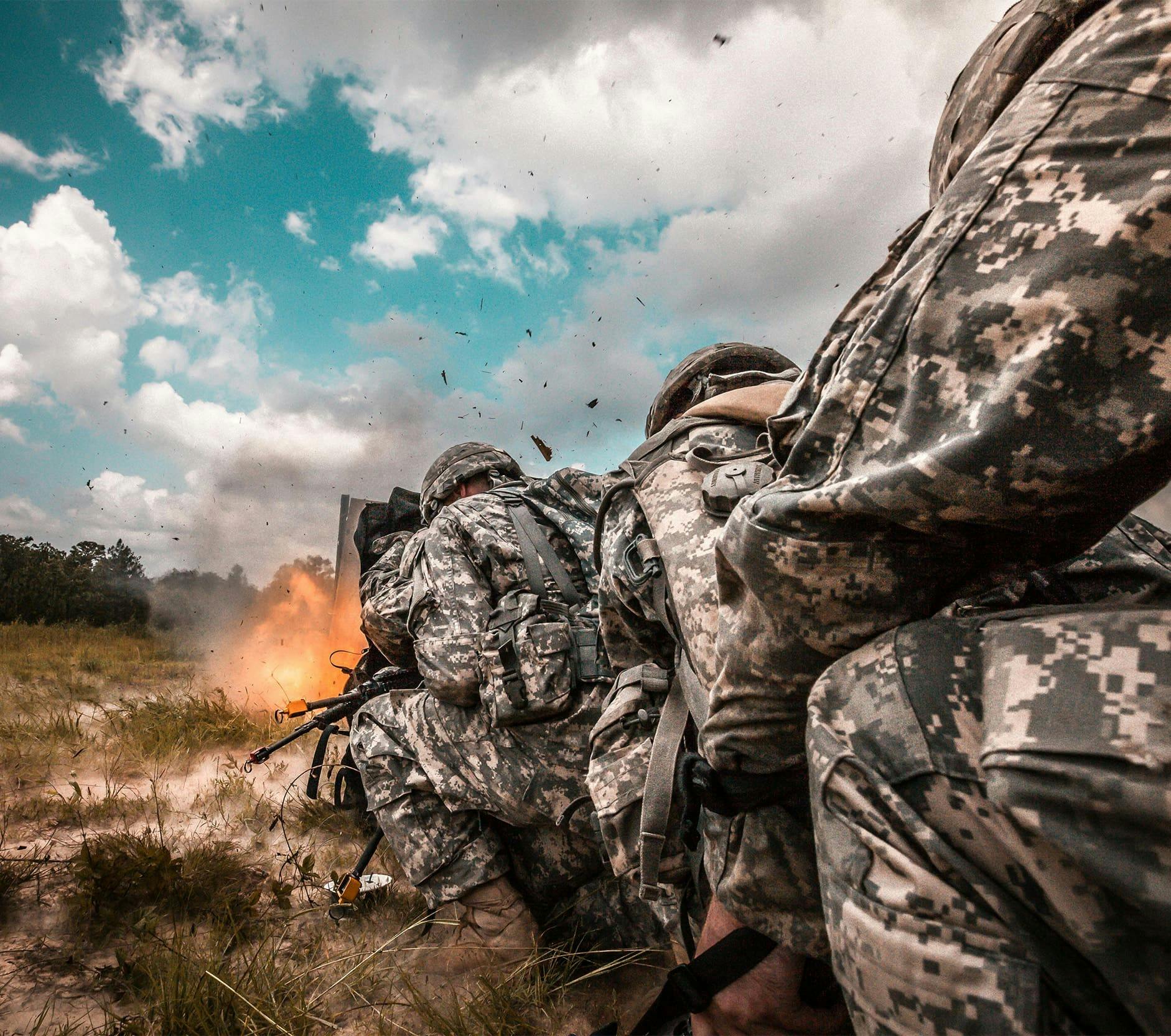 soldiers firing a weapon