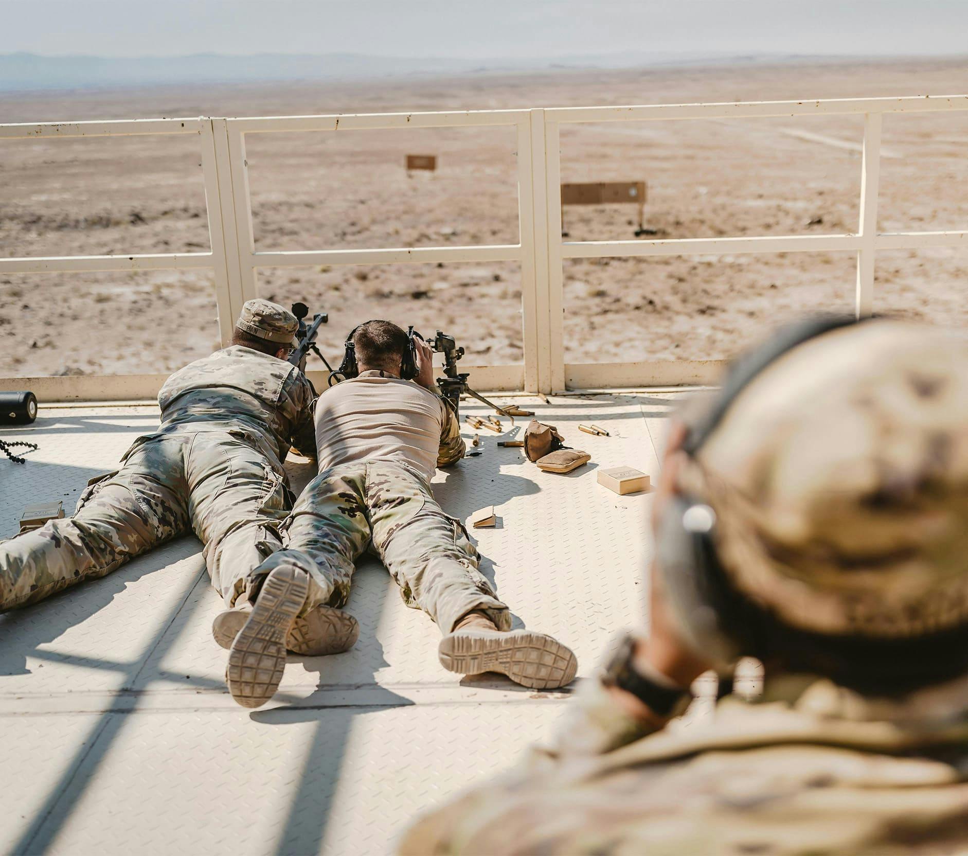 two soldiers aiming with snipers