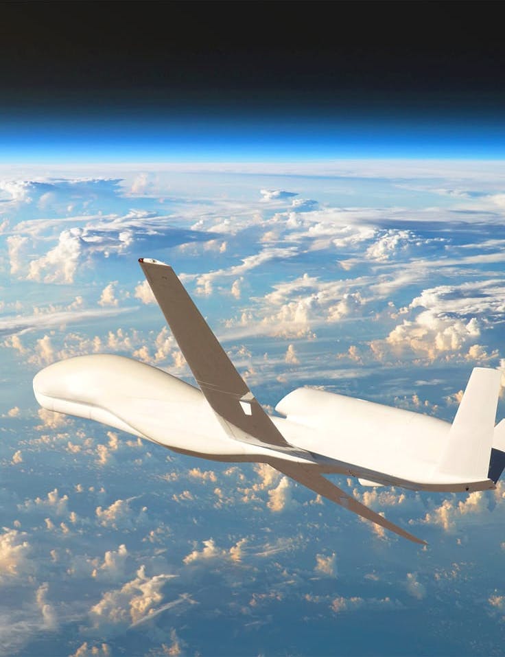 Unmanned aircraft flying above clouds