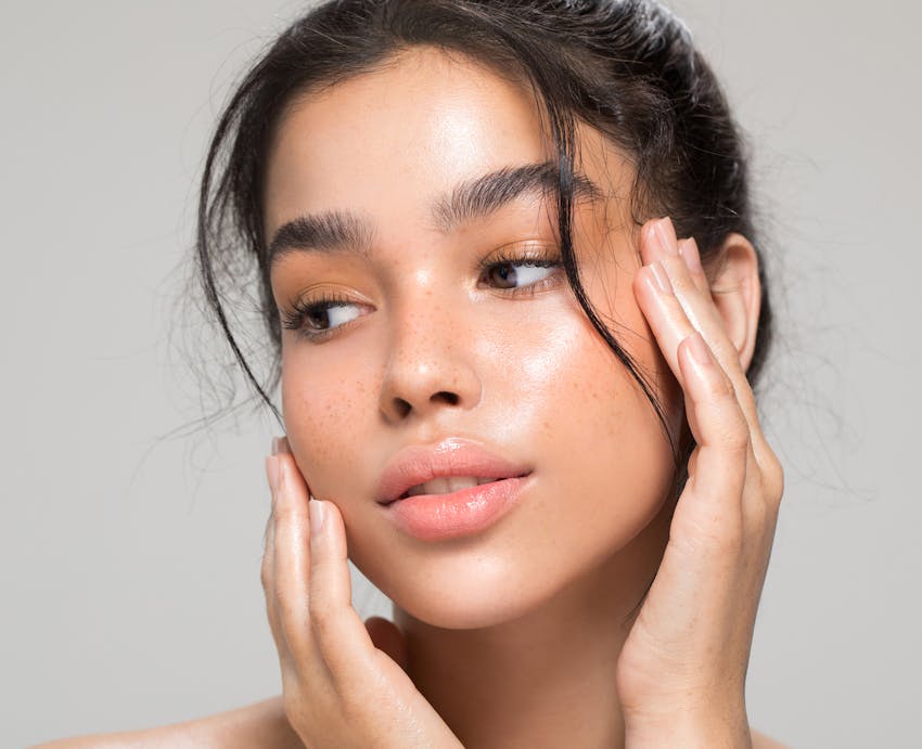 woman with hands on face