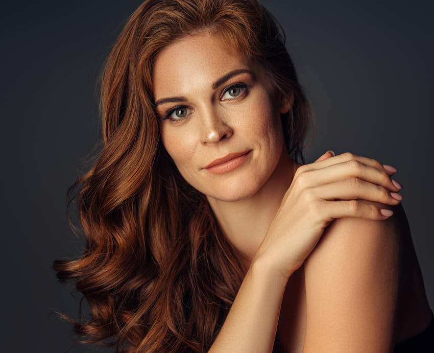 woman with hand on shoulder