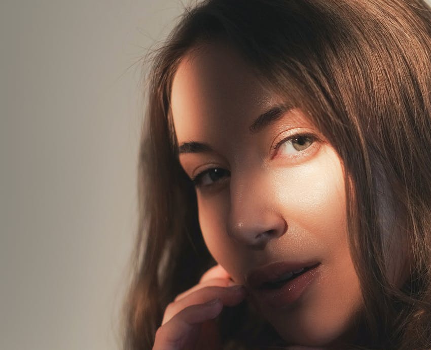 woman looking over with shadow casted on face
