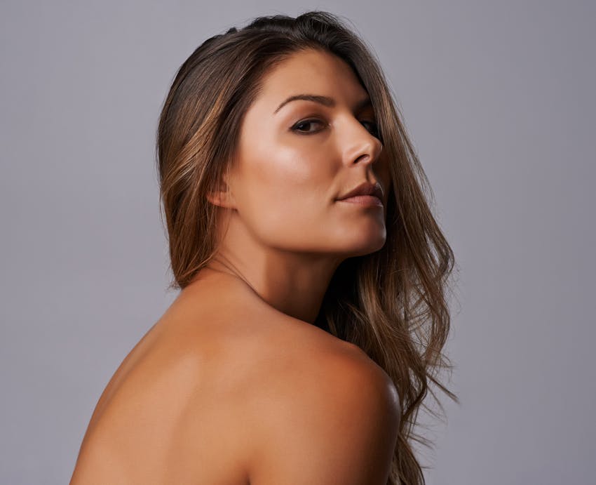 woman looking over shoulder