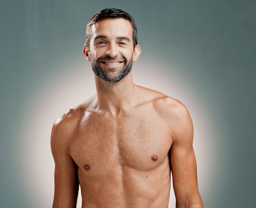 man shirtless smiling