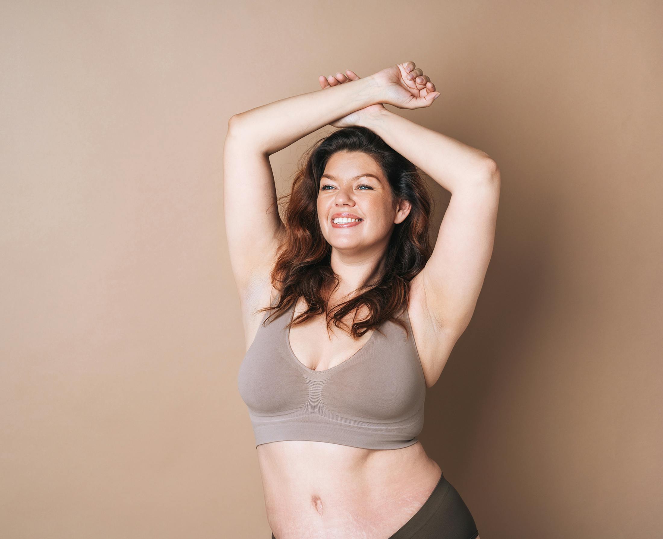 woman with hands above head