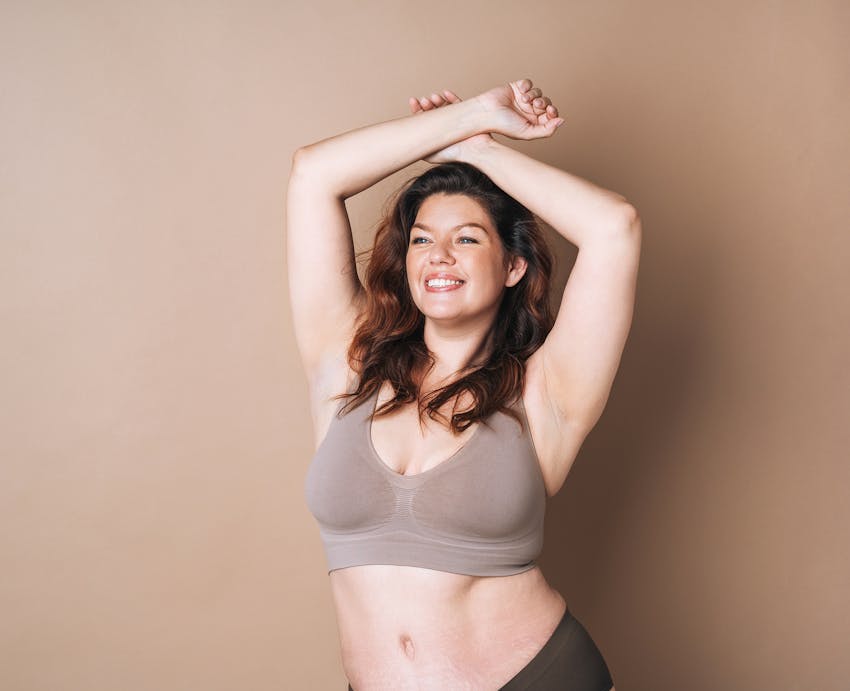 woman with hands above head