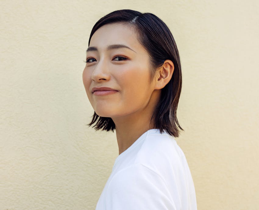 woman looking over shoulder