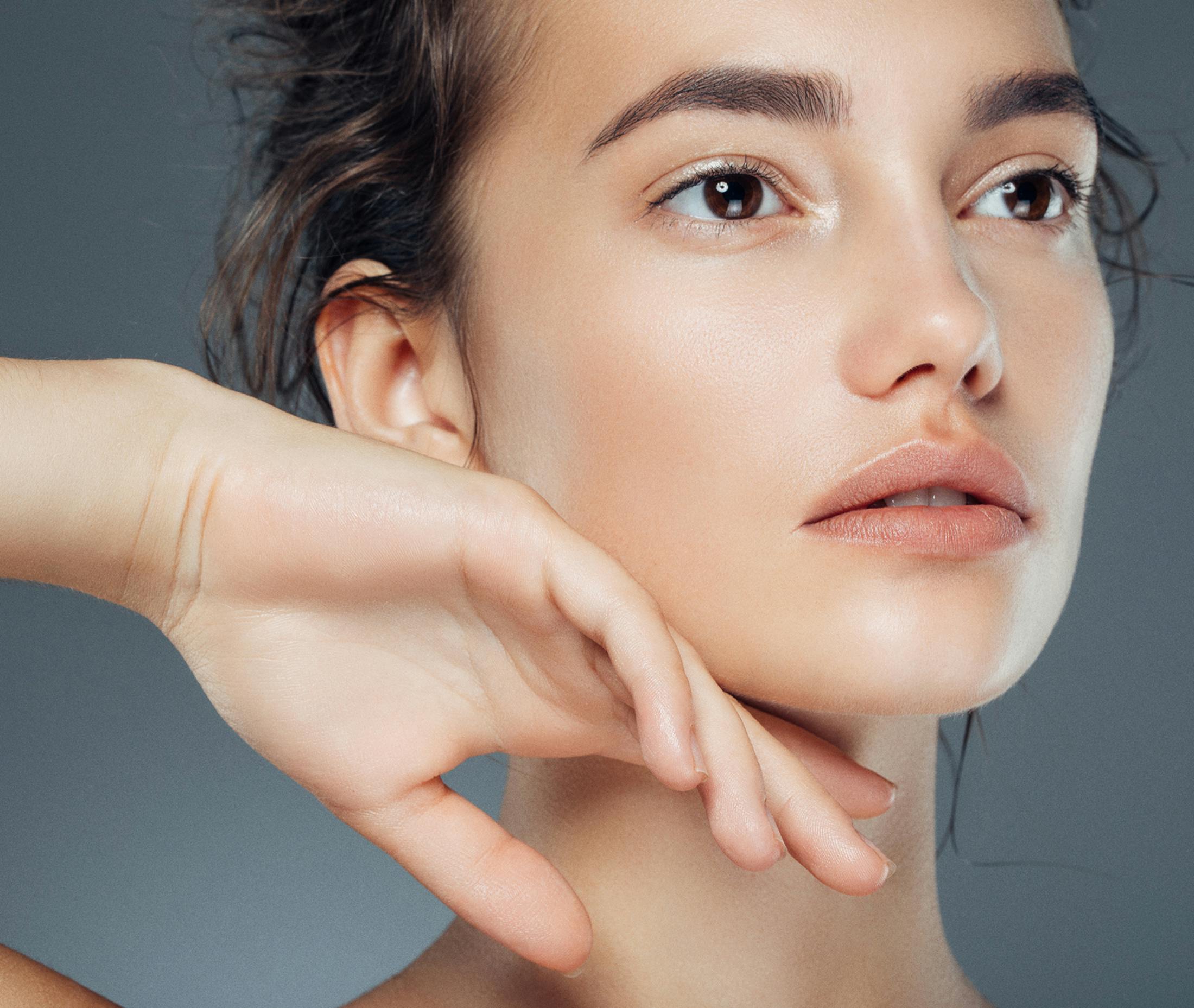 woman touching her chin