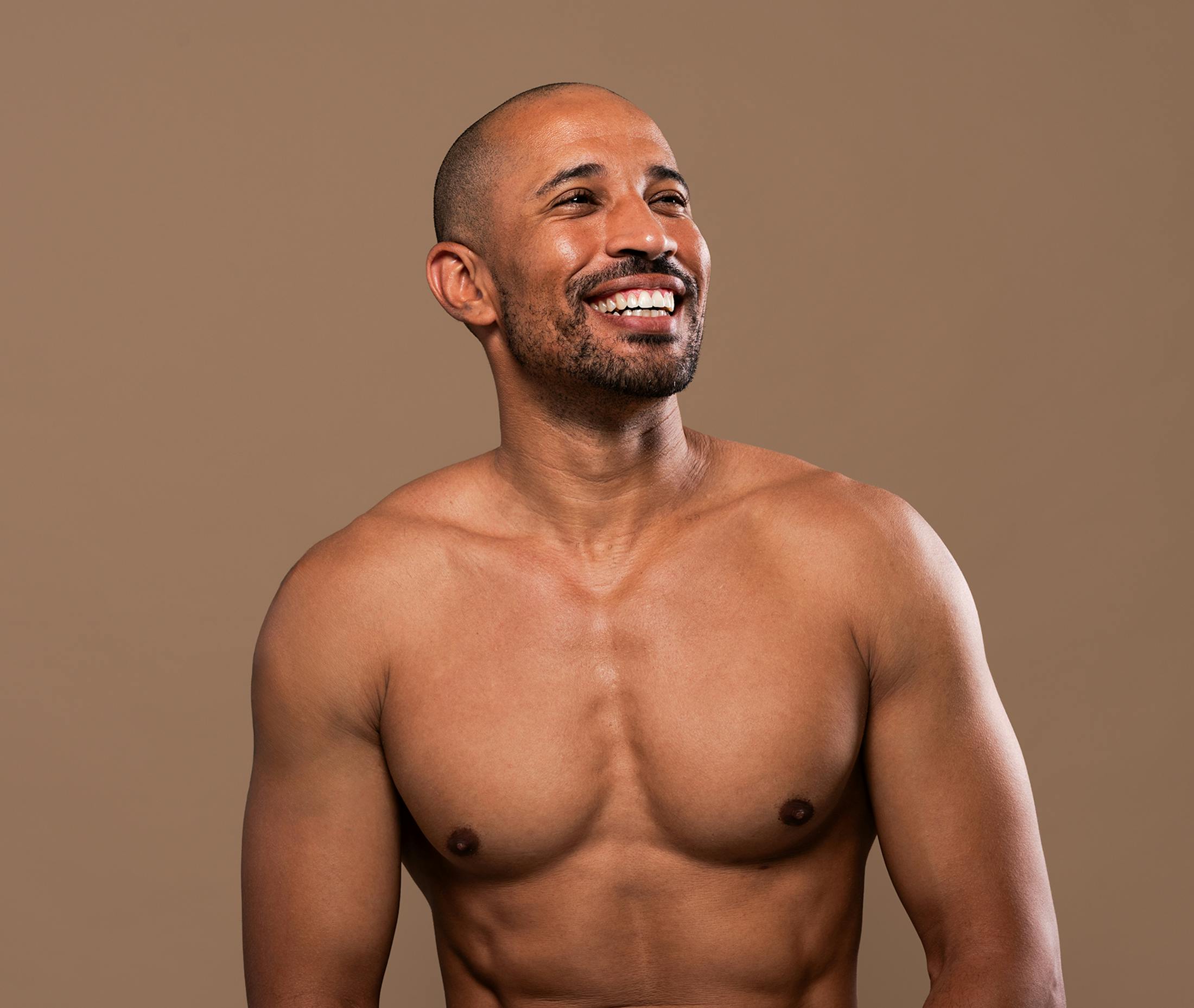 man shirless smiling