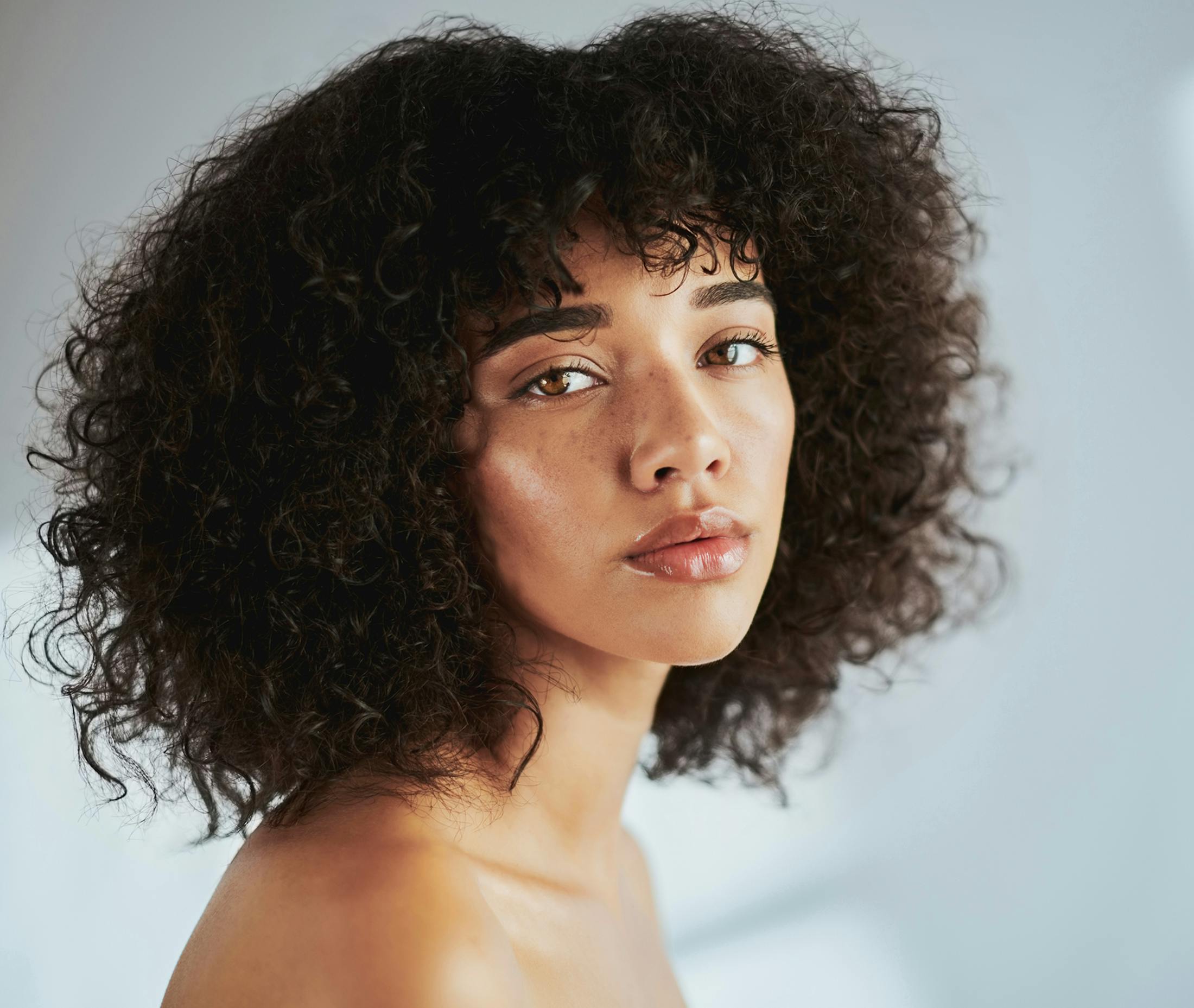woman looking over her shoulder