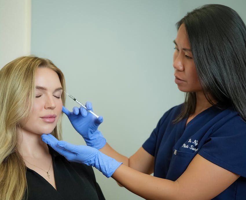 Doctor giving patient facial injections