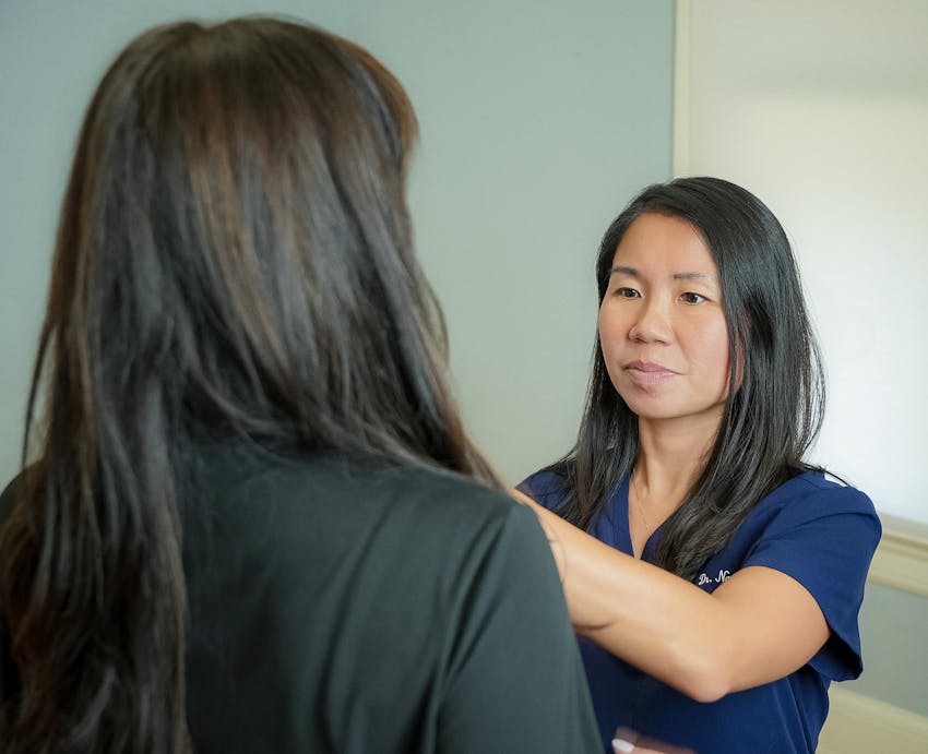 doctor inspecting patient's face