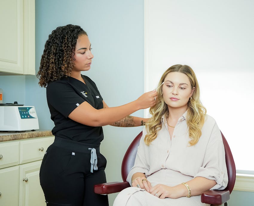 nurse inspecting patient's face