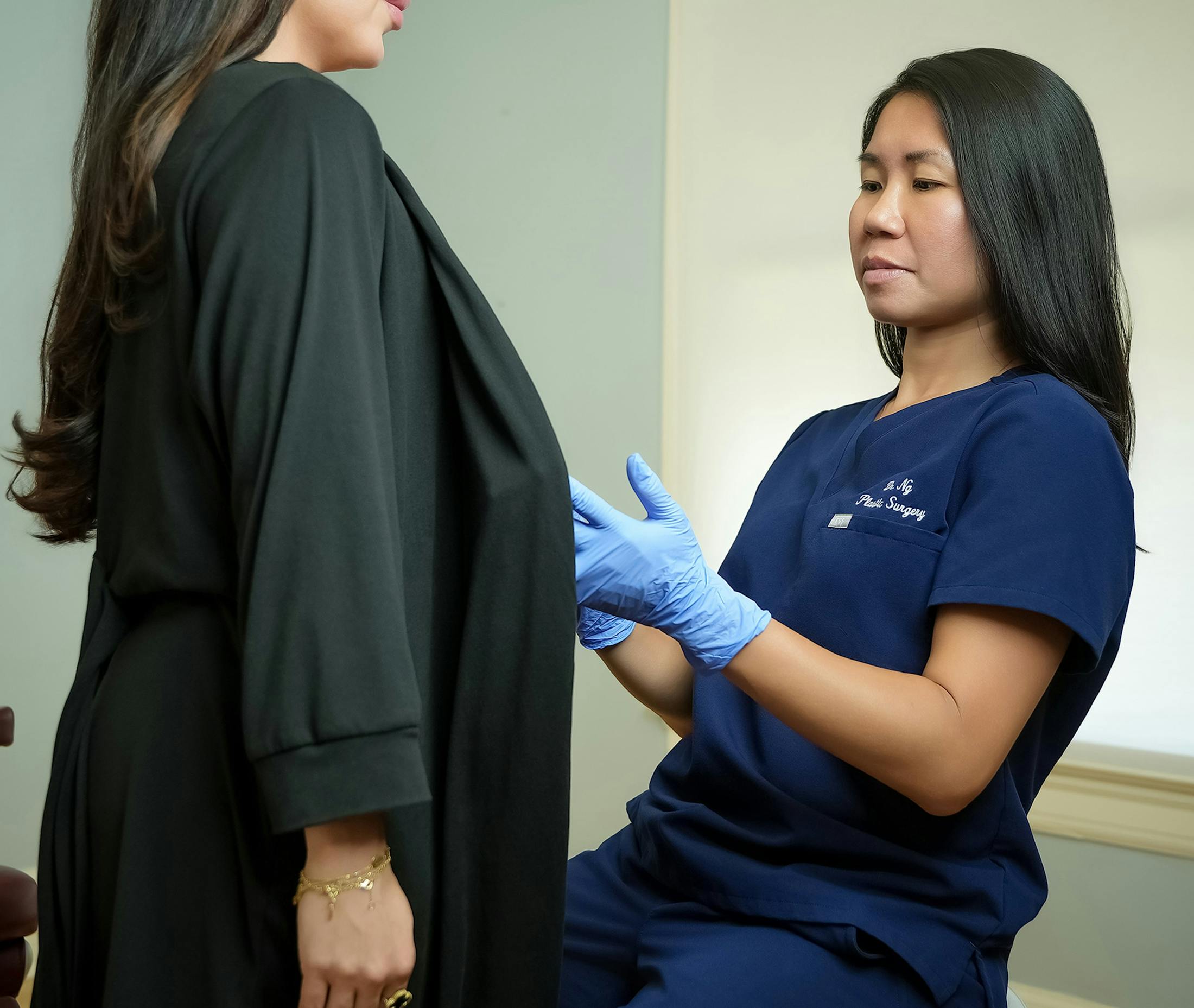 Dr. inspecting patient