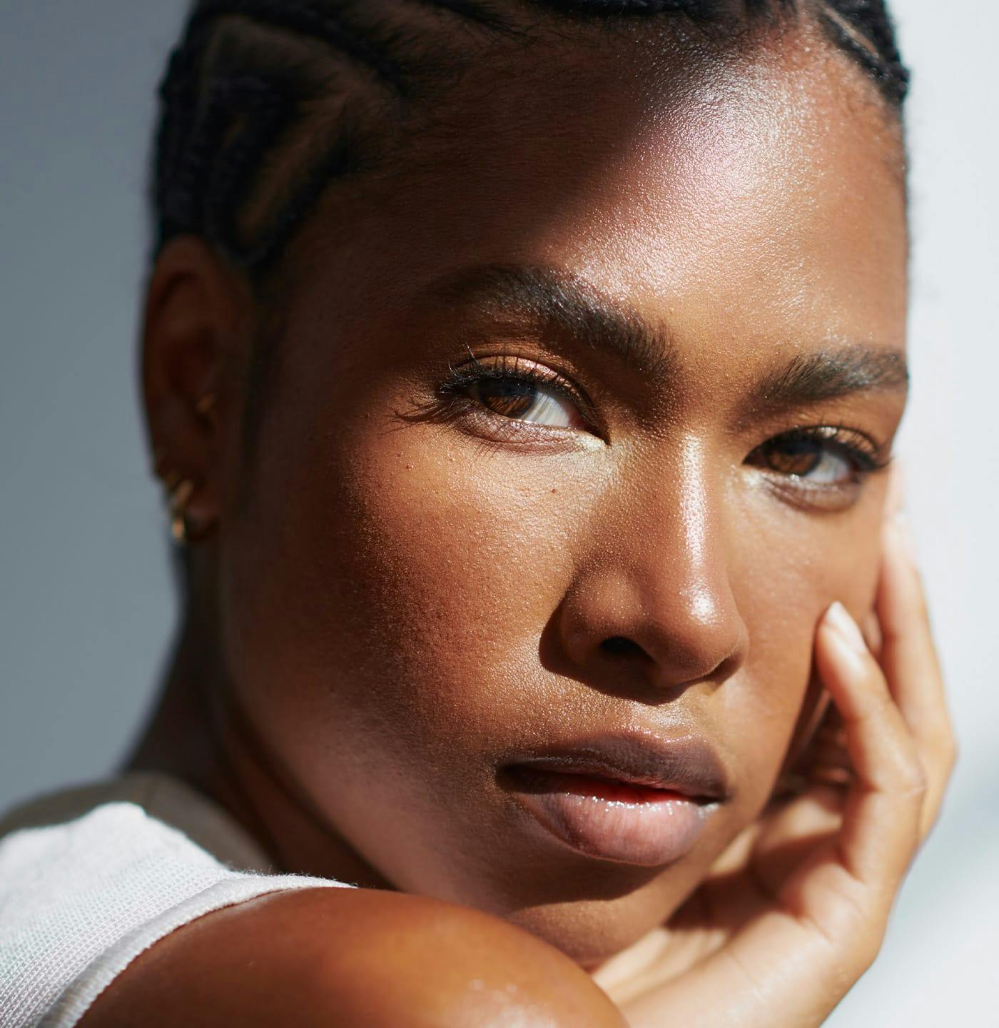 Woman touching her face