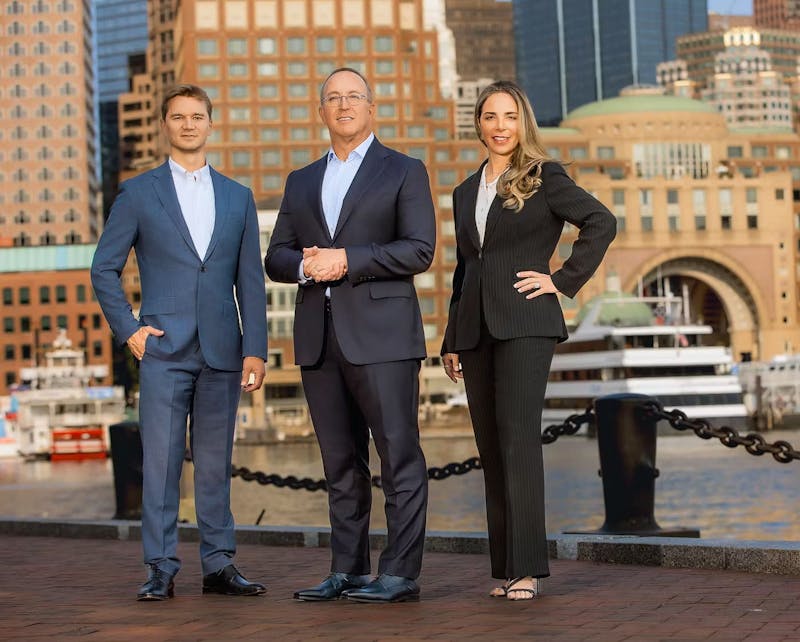 3 doctors standing outside near railing