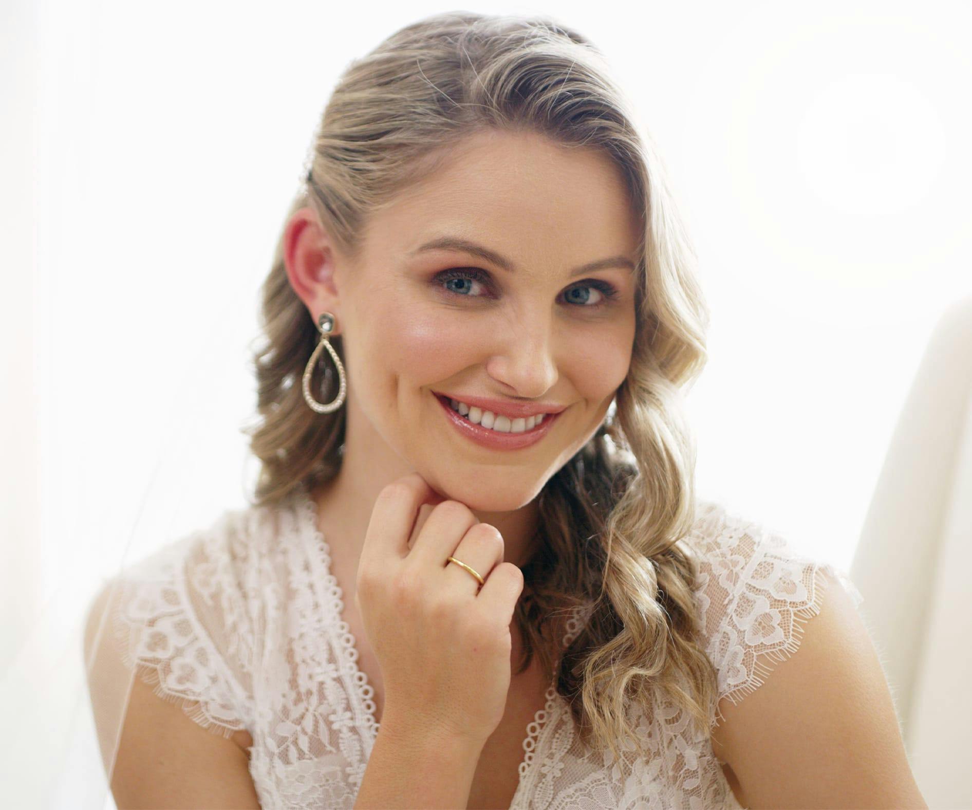 woman with her hand under her chin