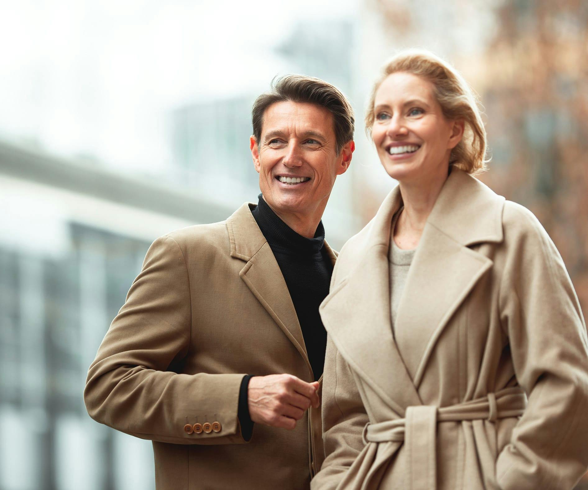 man and woman in outdoor coats on