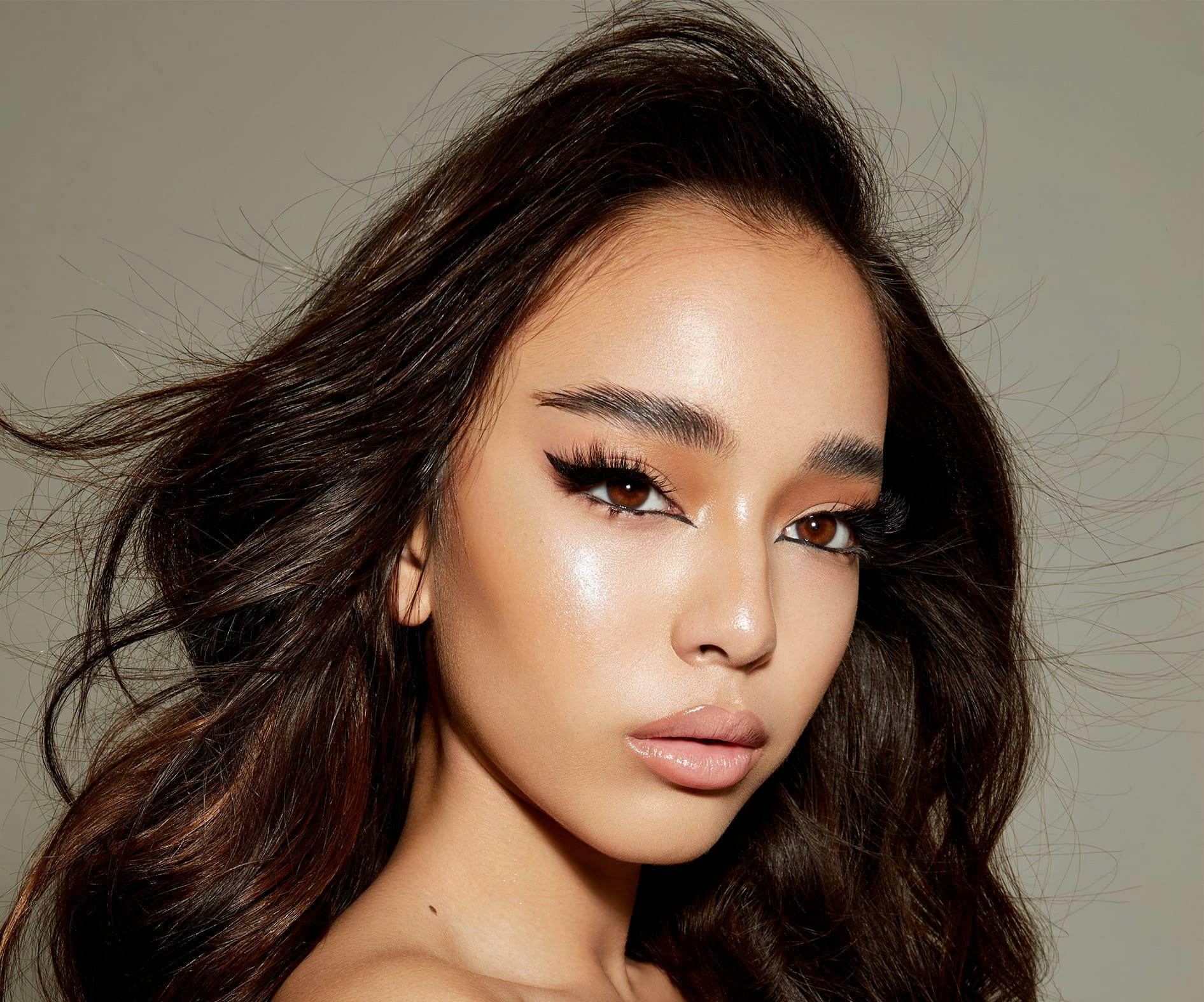 brunette woman in full glam makeup