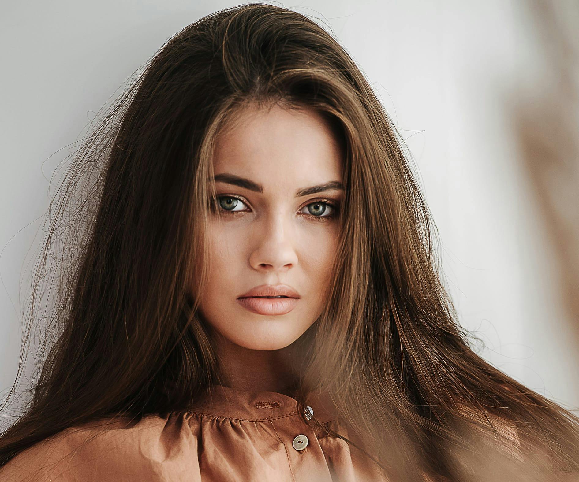 brunette woman with light colored eyes