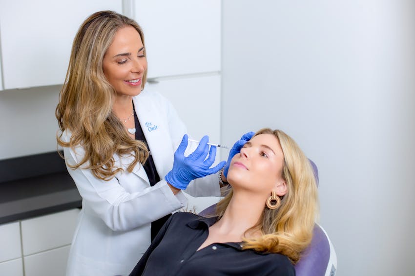 Onir injecting into patient's brow