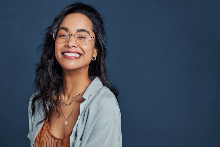 woman in glasses smiling