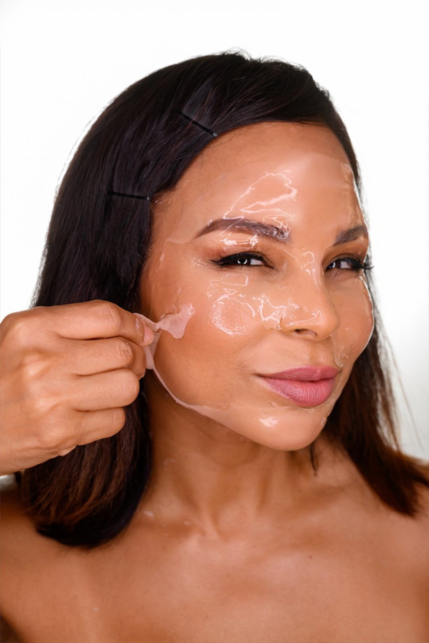 woman with skincare product on