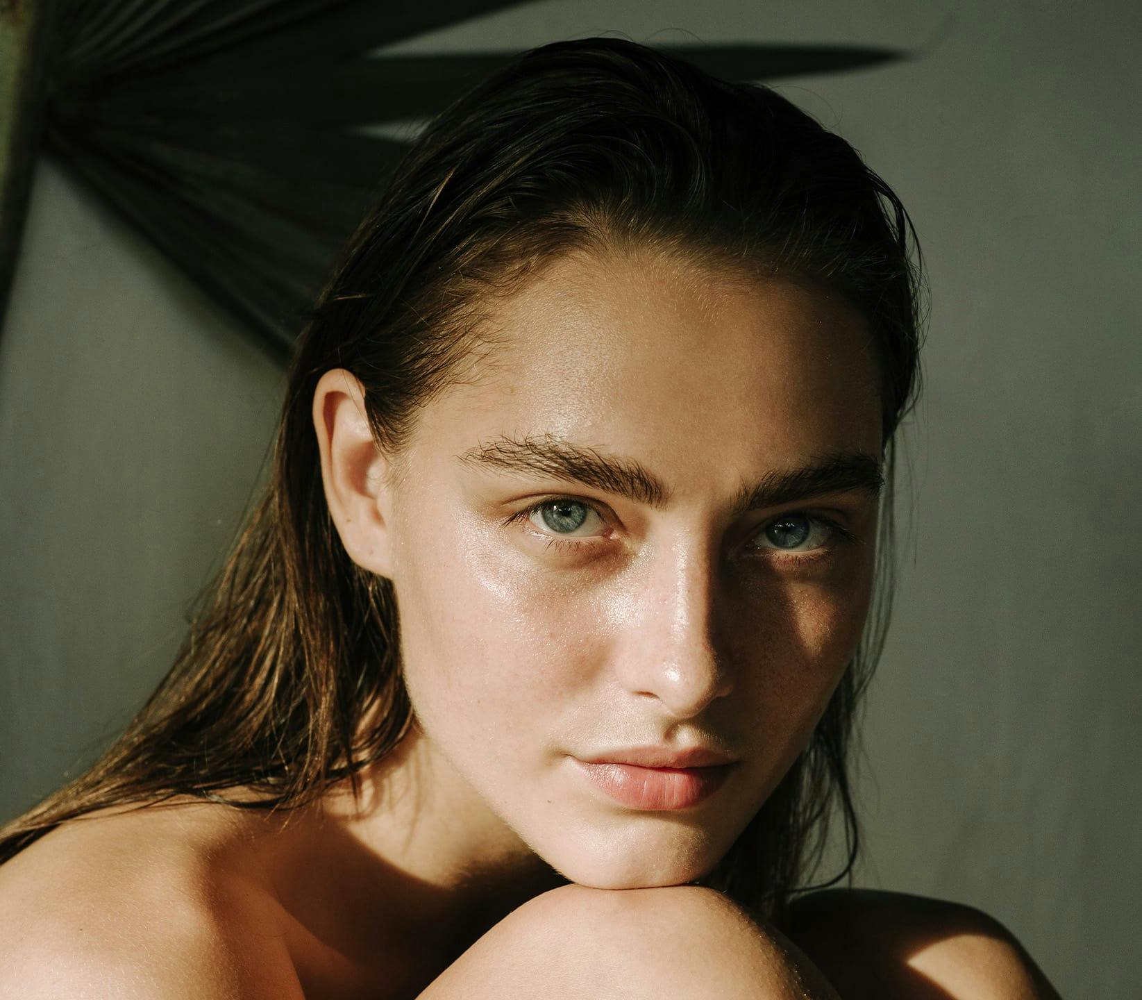 Woman resting her chin on her knee