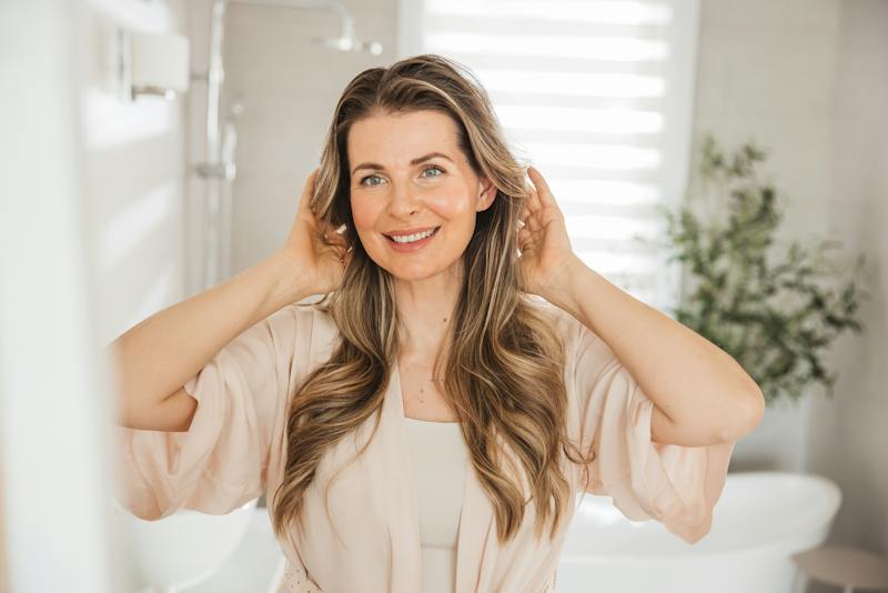 Woman touching her hair