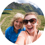two women smiling outdoors