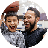 man and child with basketball