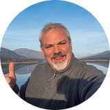 man posing near water