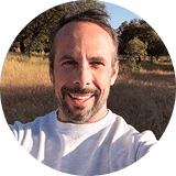 man smiling outdoors