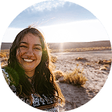 woman smiling at sunset