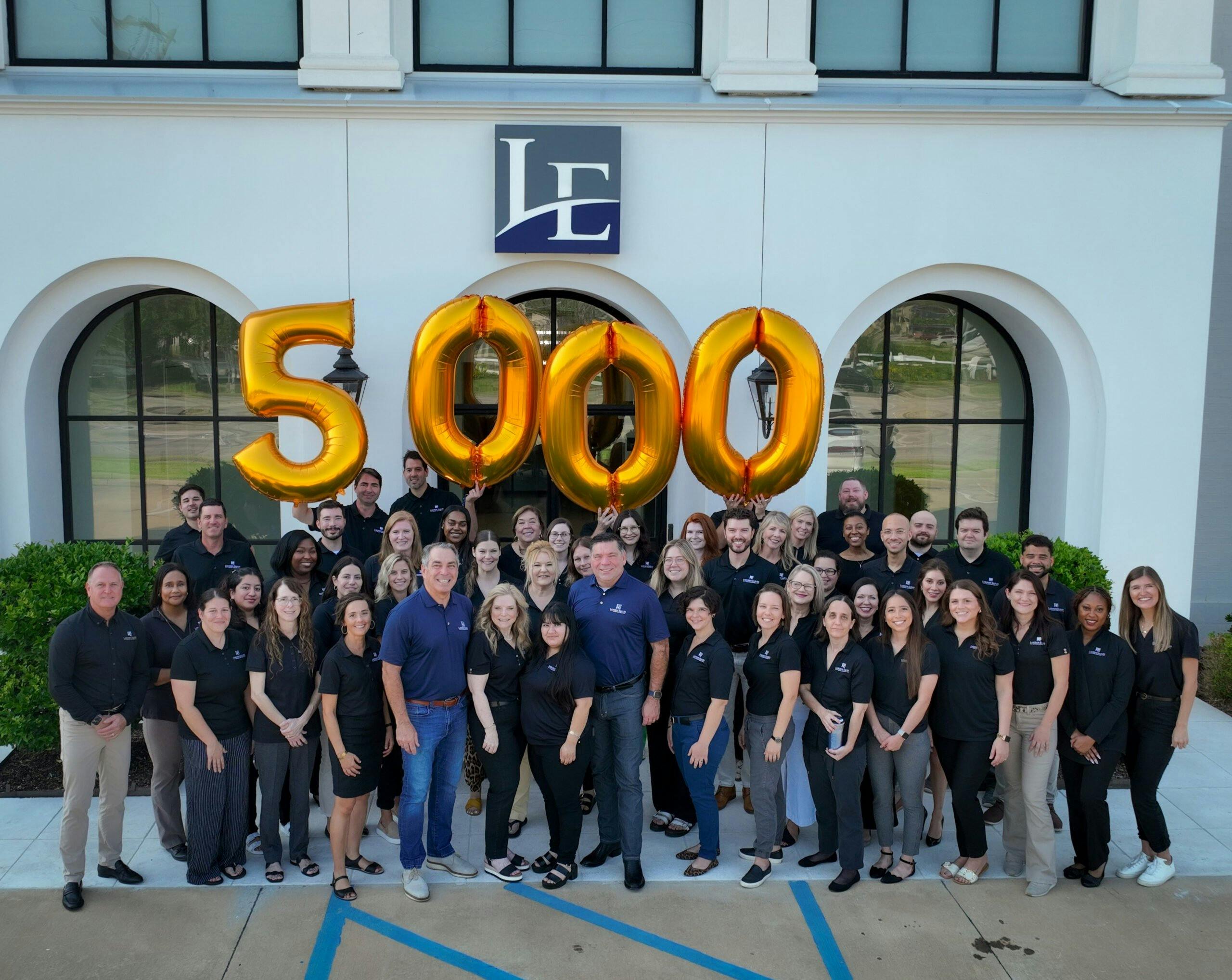 group standing in front of balloons