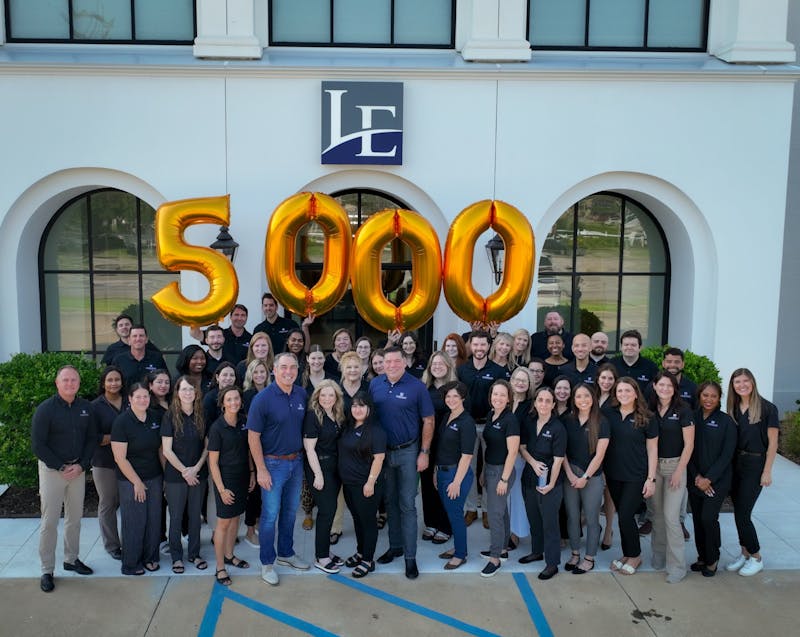 group standing in front of balloons