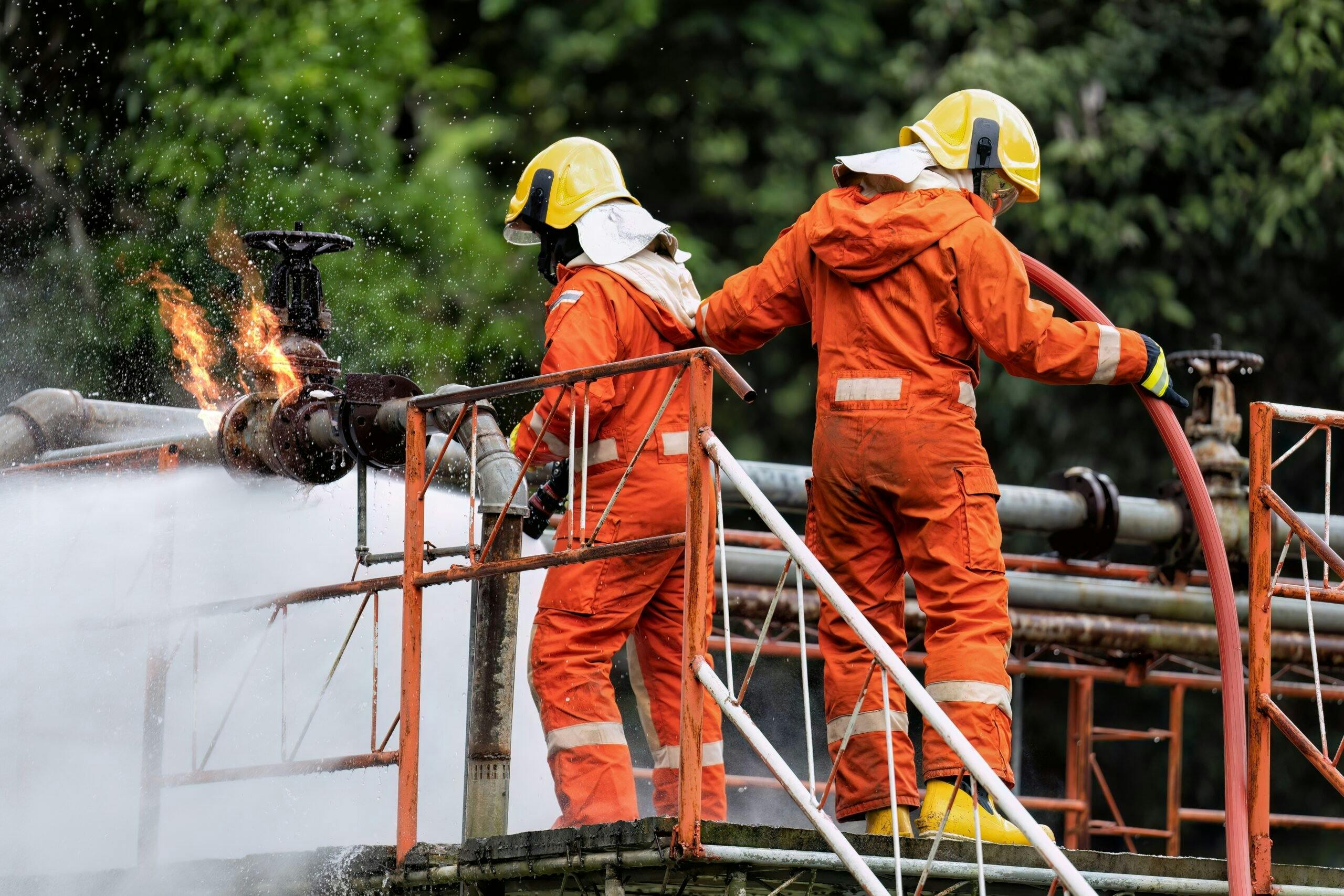two workers in orange suits