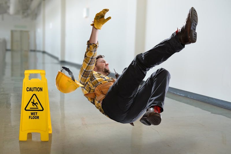 man slipping and falling on wet floor