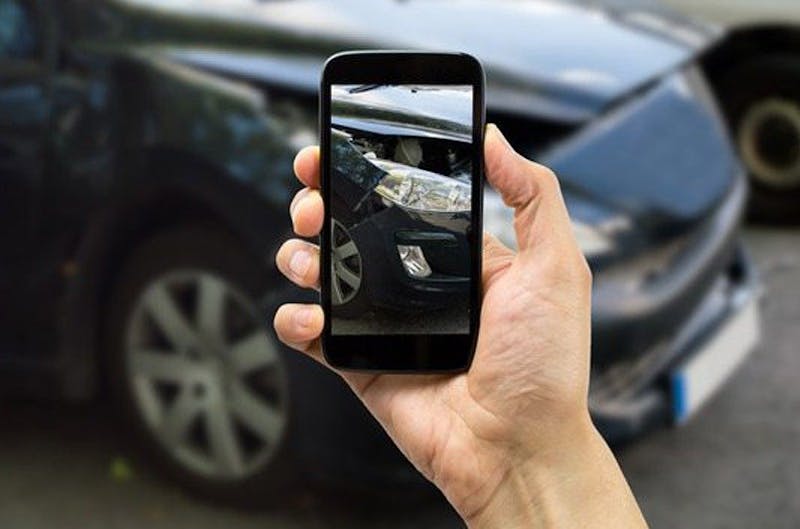 taking picture of car crash with phone