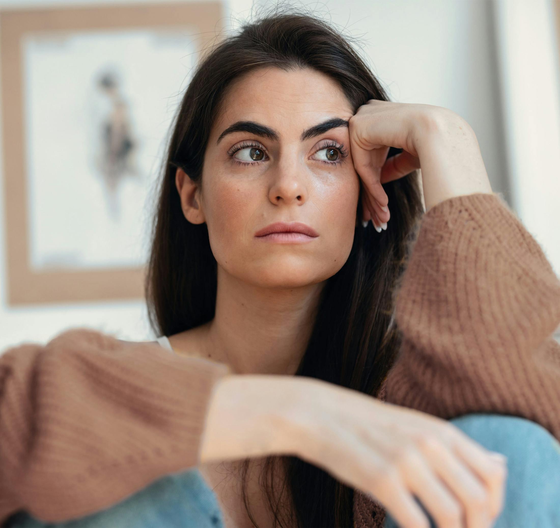 woman touching her face