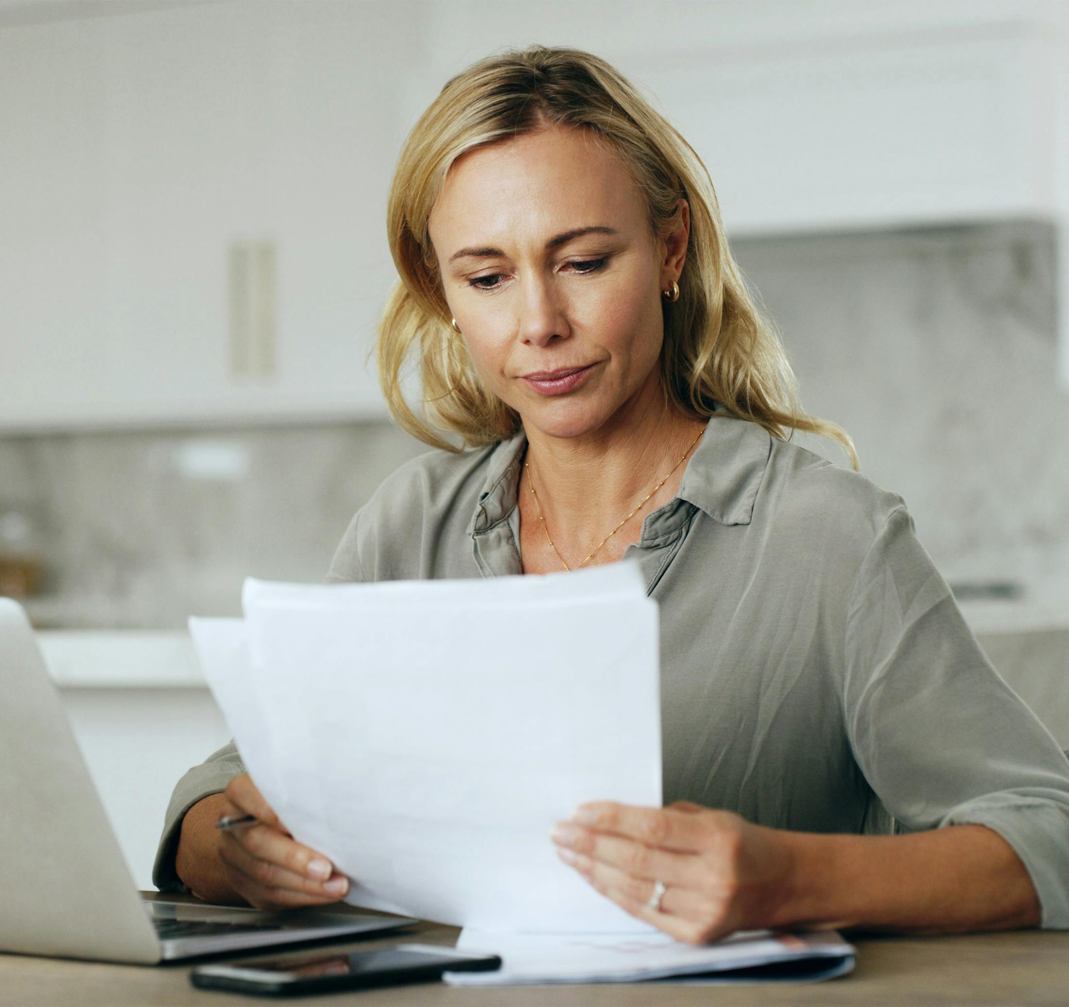 woman looking at paperwork