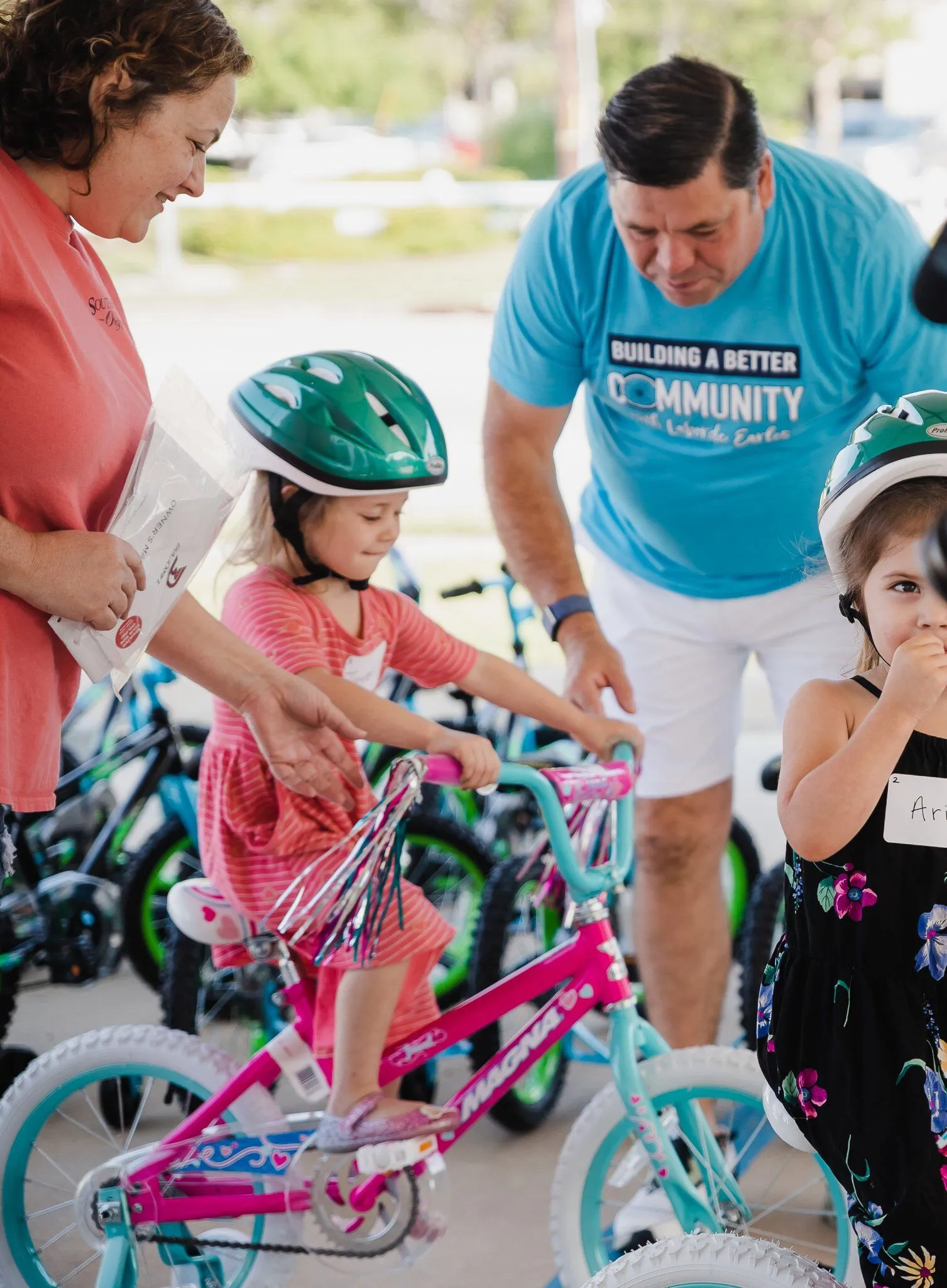A child riding a bike at event