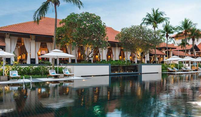 Green wide pool by Asian style building