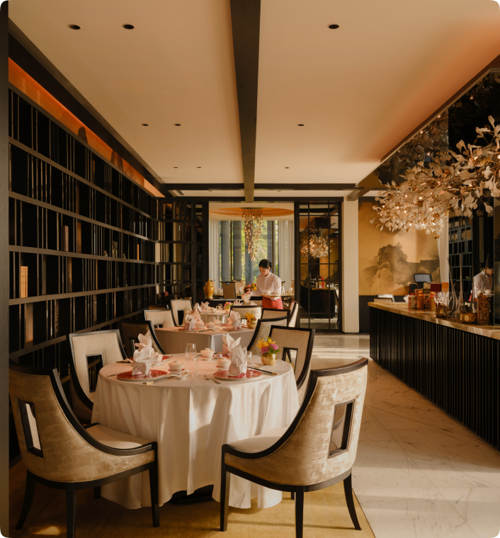 Premium looking restaurant with dark wood and cream furniture