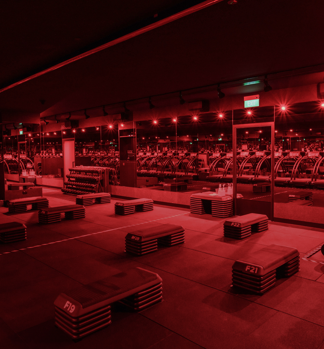 Fitness studio with mirrors and red lighting