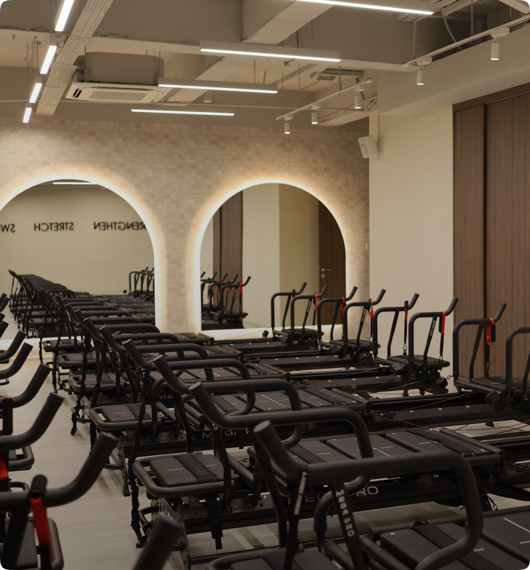 Fitness studio featuring black legree pilates machines