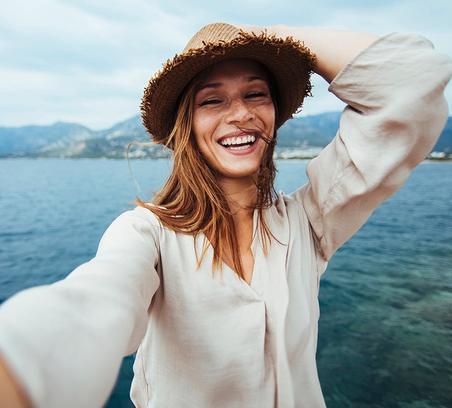 Woman Posing in Front of the Ocean