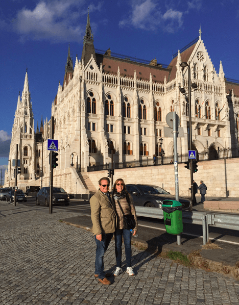 Two People in front of Parliament of Budapest